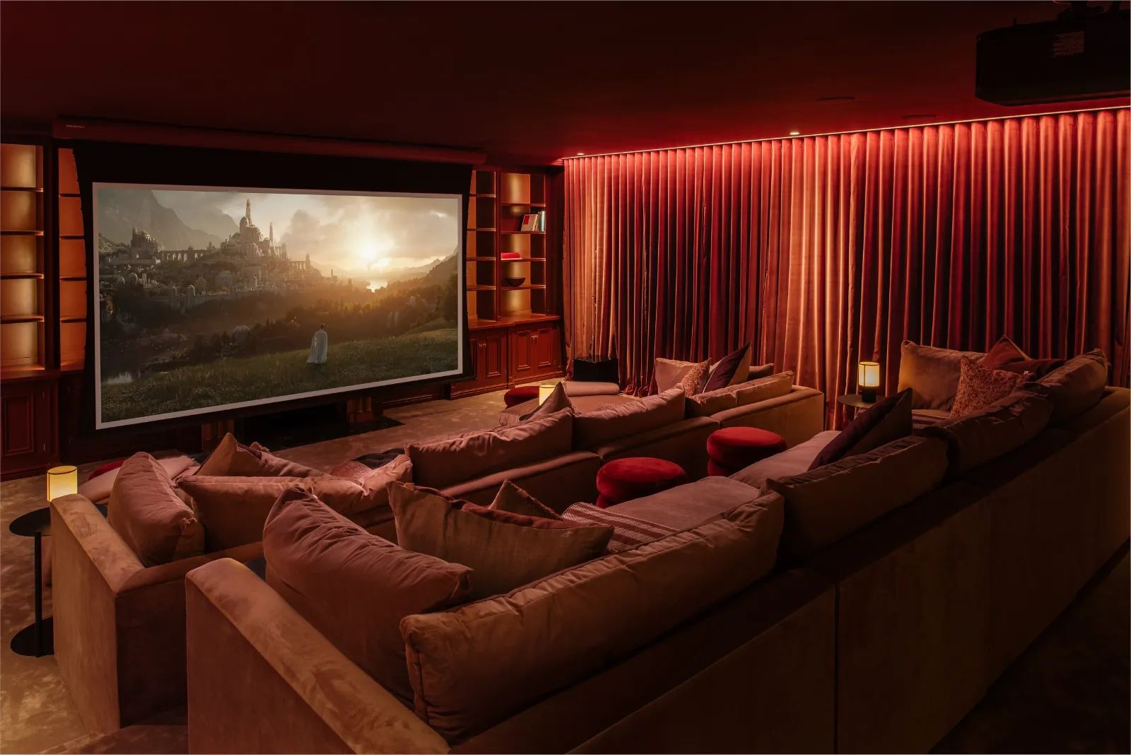 Home cinema with tiered seating and low-level lighting
