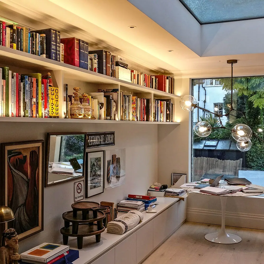 Townhouse kitchen and library shelving with integrated lighting